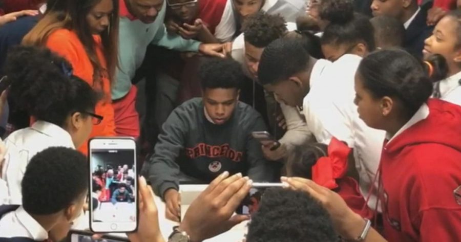 T.M. Landry students surround a fellow student while he opens a college decision letter from Princeton. Videos of T.M. Landry students opening acceptance letters from elite schools have garnered national attention over the past few years.
[Photo Credit: CBS News]