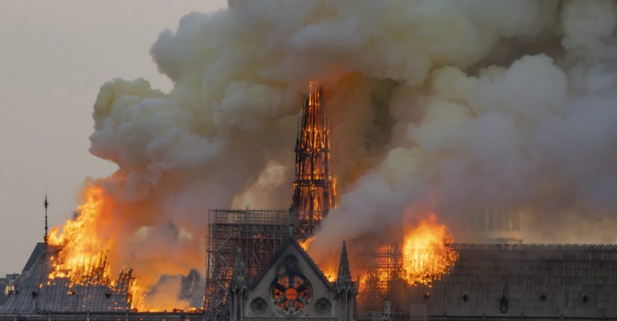 The+cathedral+spire+stands+amidst+the+smoke+and+fire.+Eventually%2C+both+the+spire+and+roof+collapse+on+this+cathedral%2C+leaving+Paris+to+cope+with+the+aftermath+of+this+tragedy.+%5BPhoto+Credit%3A+Politico+Europe%5D