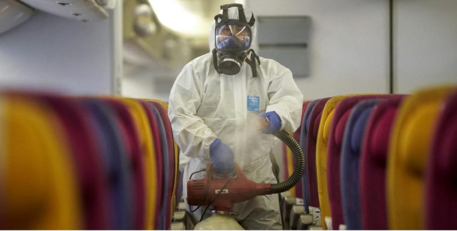 A member of the Thai Airways Crew disinfects an airplane cabin in defense against the spread of Coronavirus. Credit: Business Insider.
