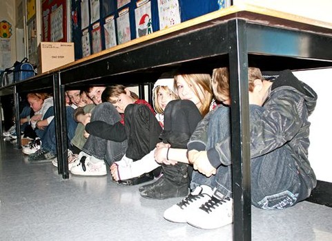 Students hiding under desks as part of a lockdown drill. (Photo credit: Ohio Education Association)