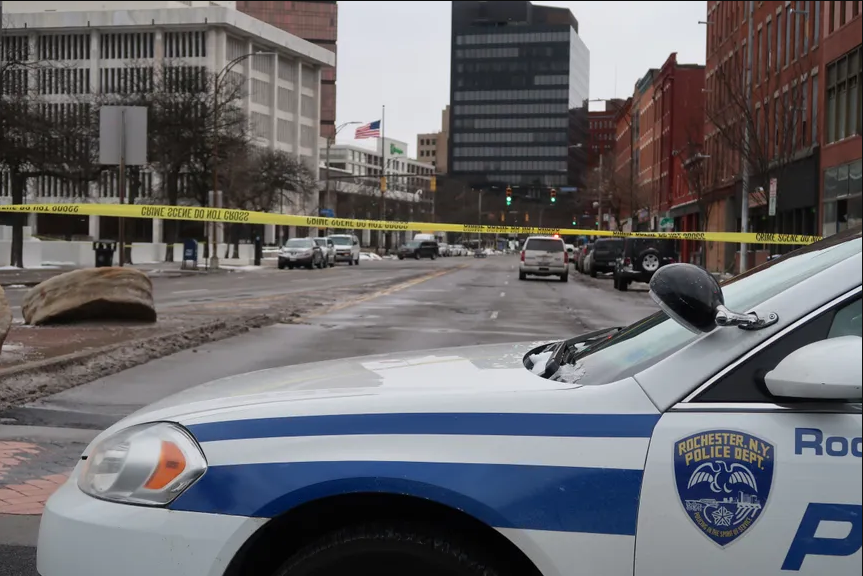 Large portions of the roads surrounding the Federal Building were closed off, barring civilian access. Following reports of a suspicious package, numerous streets around the building were placed under lockdown. (Credit: Democrat & Chronicle)