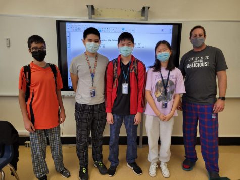 Mr. Zak and four of his Pre-Calculus Honors students, Avishai Aghelian, Alex Zhuang, Lawrence Zeng, and Katherine Sun, wear pajamas.