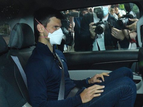 Djokovic on his way to a court hearing at his lawyer’s office in Melbourne (Credit: NPR).