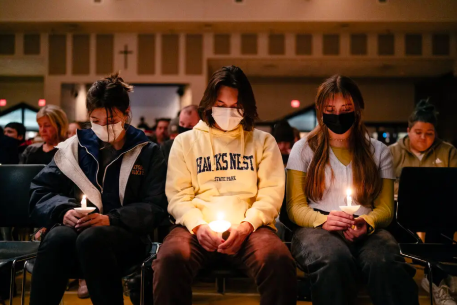 Students from Oxford High School gather for a candle lighting service in honor of the victims of the shooting. Credit: Nick Hagen, The New York Times.