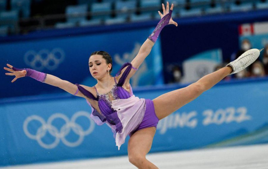 15-year-old Russian figure skater Kamila Valieva executes a spotless triple axel in the Olympics’ Team Event (Credit: The Boston Globe).