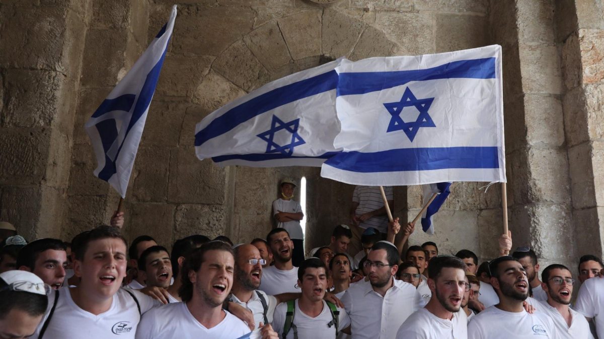 Israelis coming together to wave the flag (Credits: BBC news)
