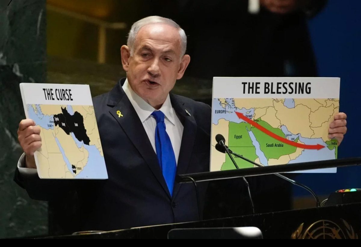 Prime Minister of Israel Benjamin Netanyahu hold signs while he addresses the United Nations (Pamela Smith/AP).
