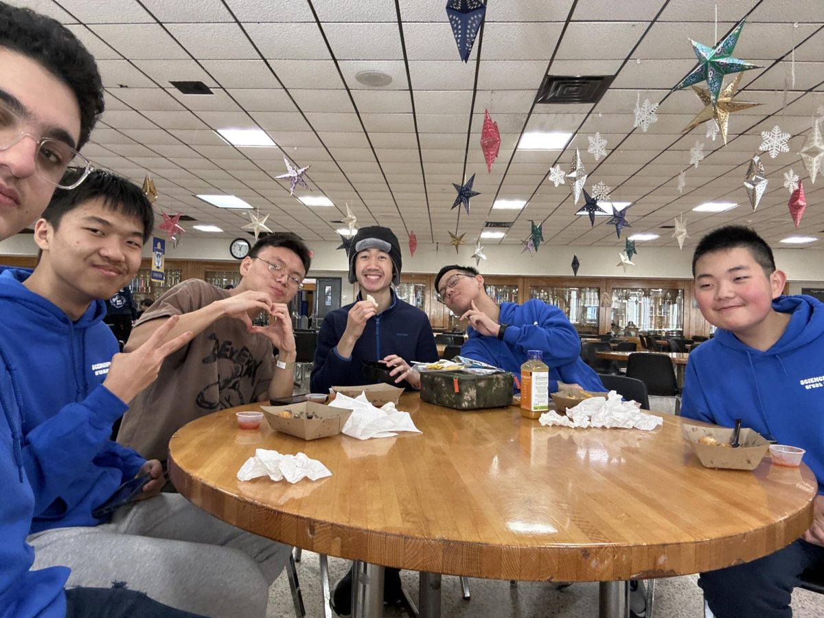 My friends and I at the SciOly regional 2023, eating lunch and definitely not inexorably stressing about events that we didn’t study for (Credit: Johnathan Ahdout).